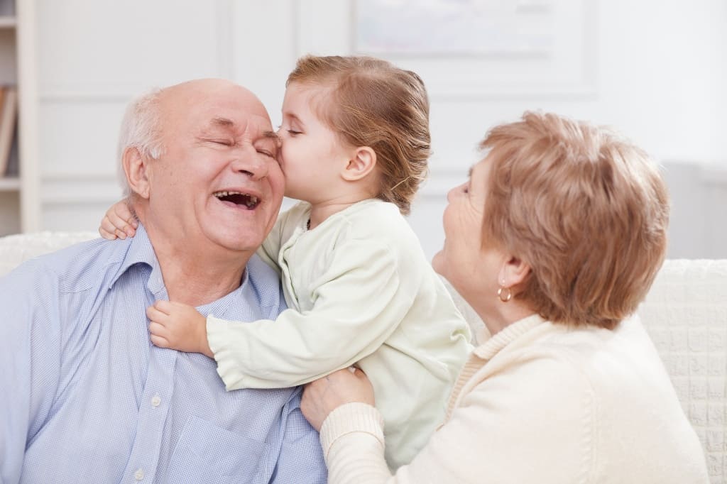 Grandparents Laughing with Their Grandchildren