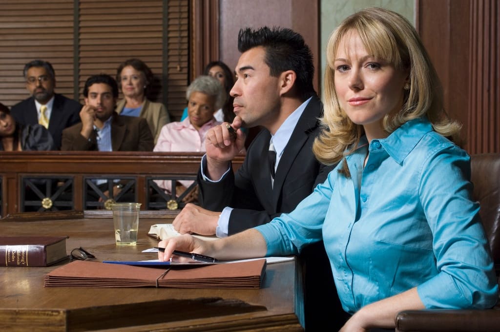 Lawyer Sitting With His Client